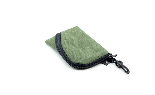 A Mini Ghost Whale Pouch in Boreal (pale green).